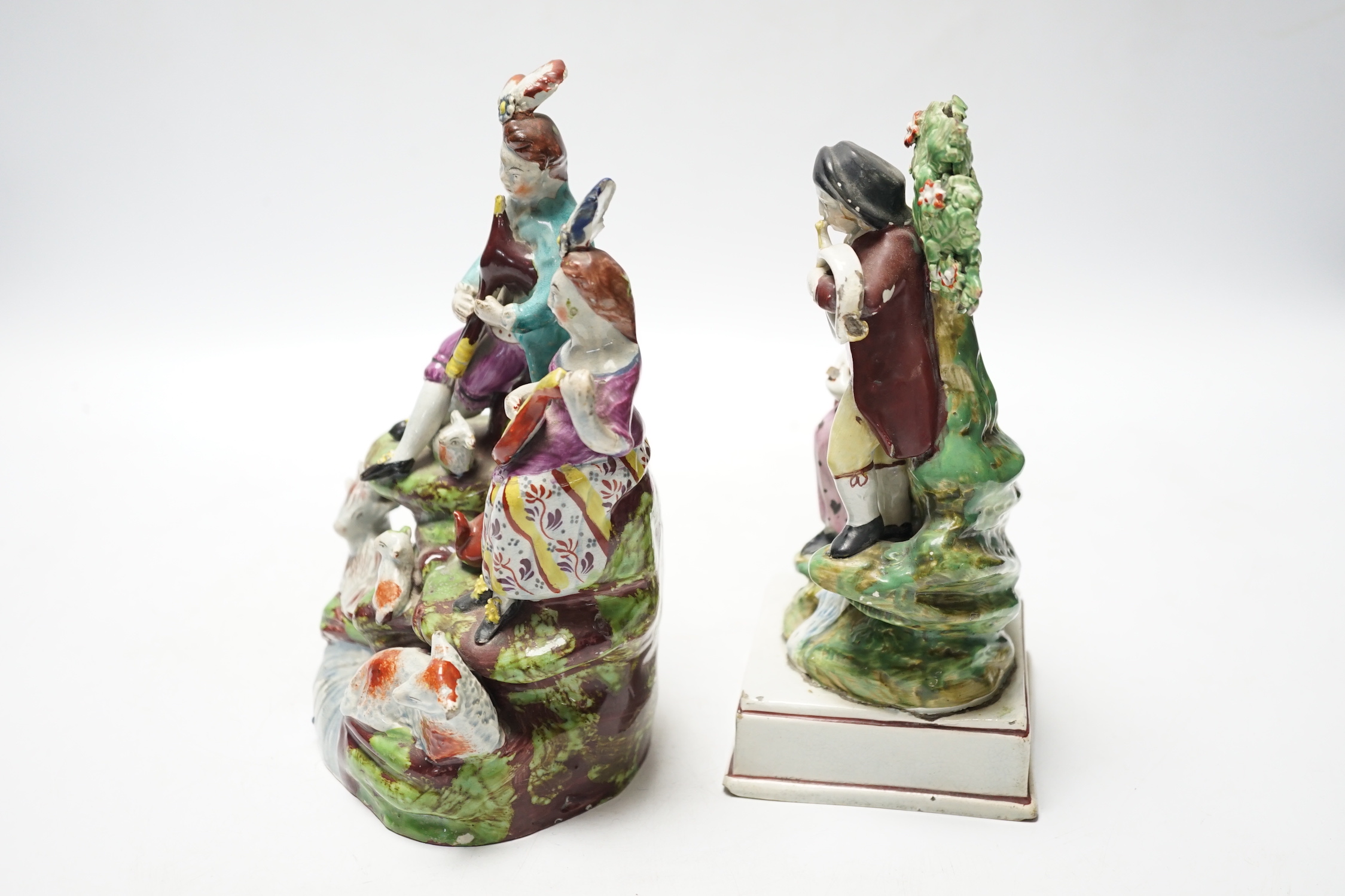 Two Staffordshire pearlware groups of musicians, c.1810-25, largest 20cm high